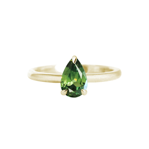 Handmade in 18ct yellow gold, this solitaire engagement ring features a Pear Cut Australian Green Sapphire, clasped in a minimalistic three prong setting.