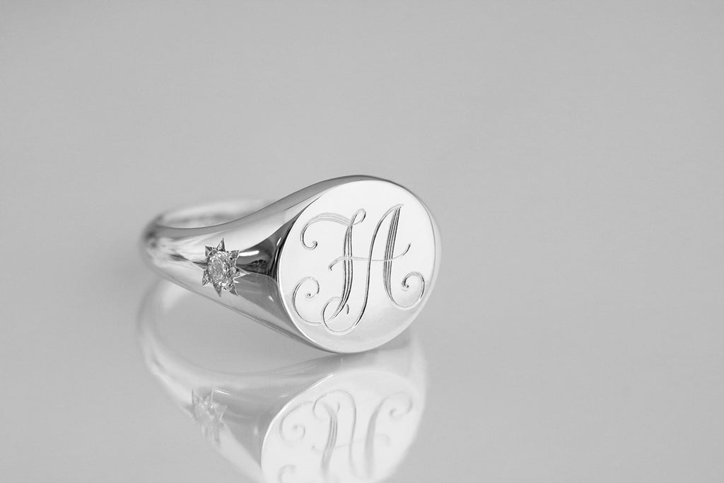 engraved signet ring with star set diamonds