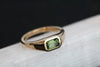 This yellow gold signet ring features a bezel set Emerald Cut Australian Sapphire, in east-west orientation. Perfectly showcasing the unique beauty of Australian sapphires, this one of a kind ring could be worn as an alternative engagement ring, or simply as a cherished everyday ring.