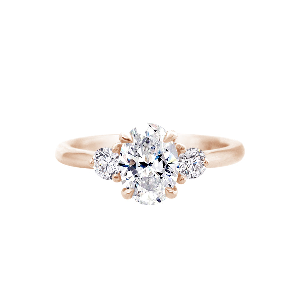 Oval Diamond Trilogy Engagement Ring With Side Diamonds Rose Gold