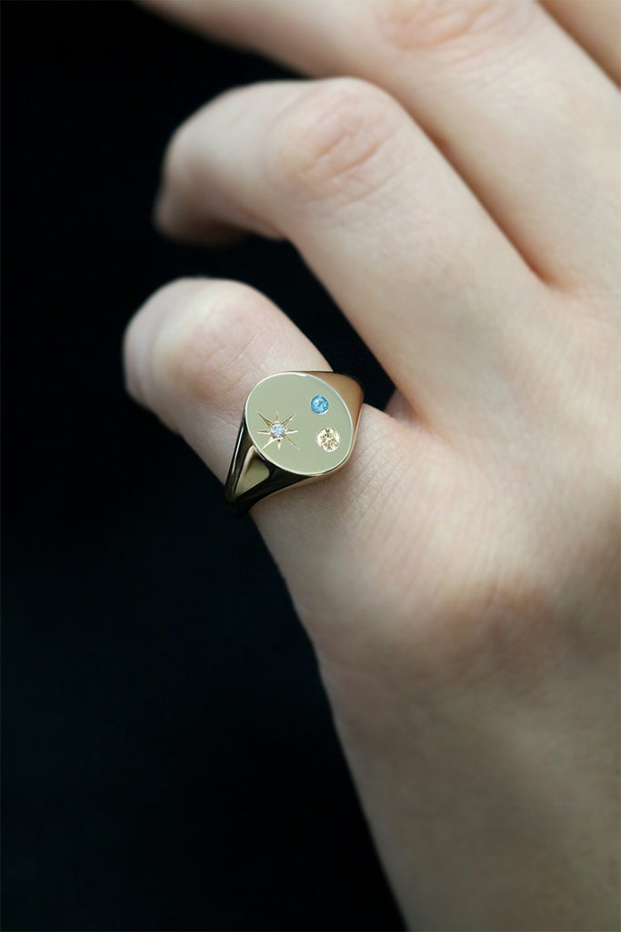 Oval Signet Ring with Champagne Diamond Blue Topaz and Star Set Diamond Yellow Gold