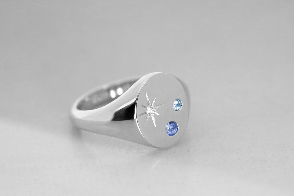 Oval Signet Ring with Blue Sapphires and Star Set Diamond White Gold