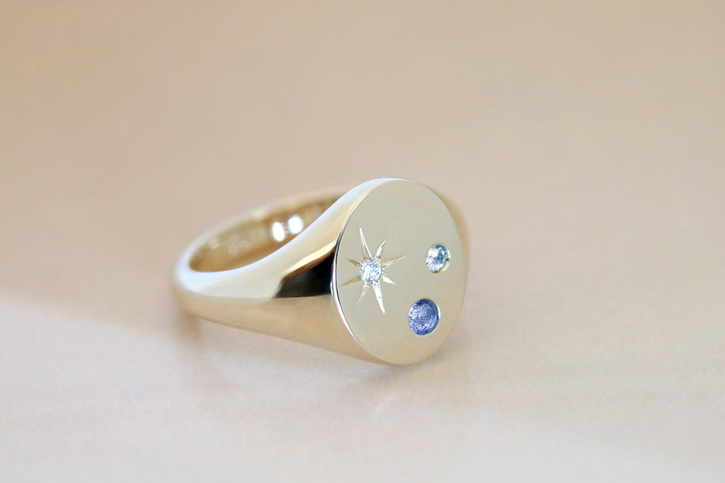 Oval Signet Ring with Blue Sapphires and Star Set Diamond Yellow Gold