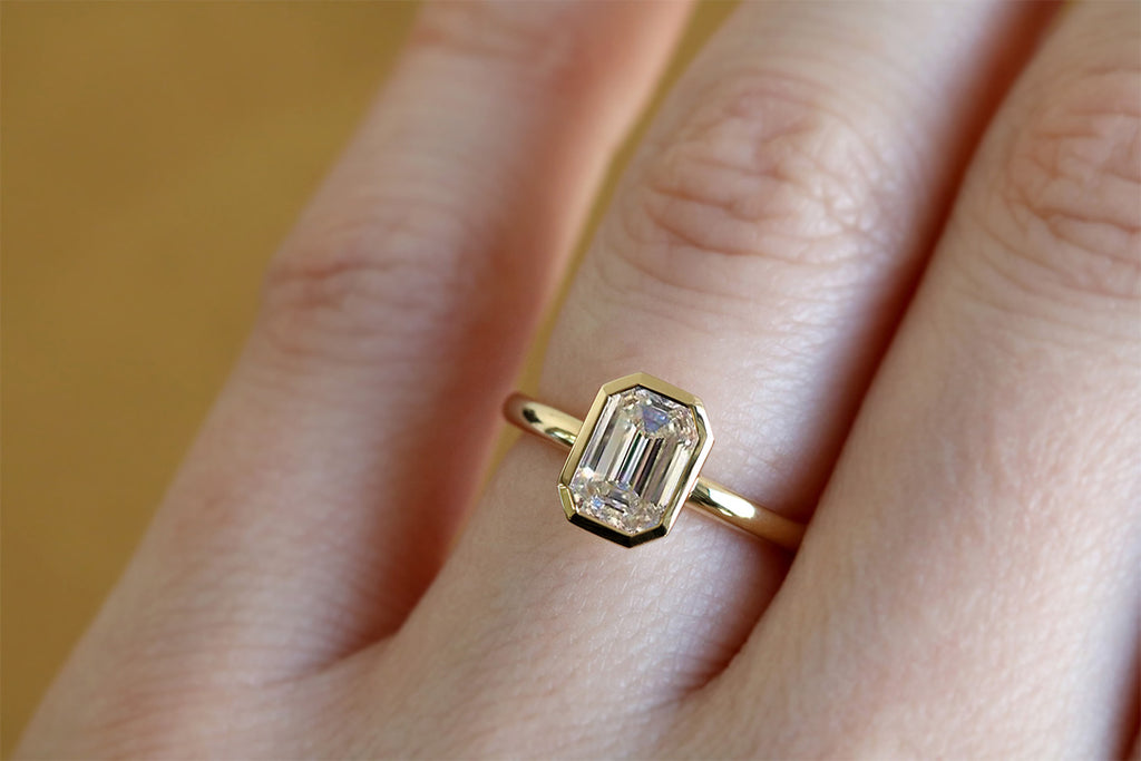 Bezel Set Emerald Cut Diamond Engagement Ring Yellow Gold