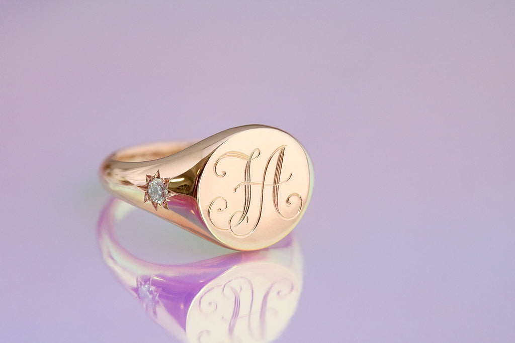 rose gold monogram signet ring with star set diamonds
