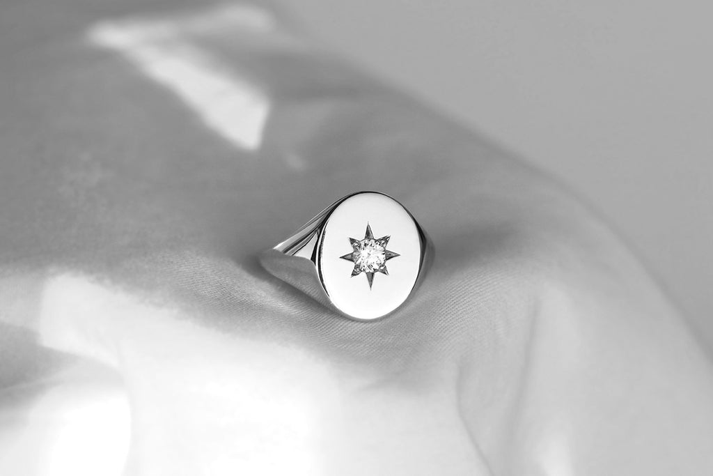 large oval star set diamond signet ring