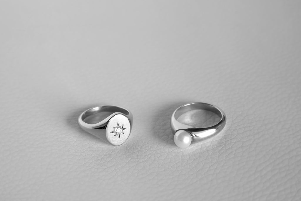 oval signet ring with diamond, and pearl signet ring